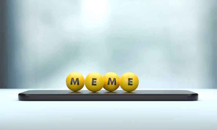 Meme Written Yellow Spheres Sitting On Mobile Phone.