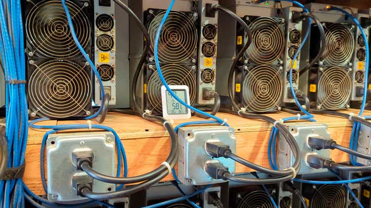Close-up of ASIC machines, in series, mining cryptocurrencies. A cryptocurrency mining farm.