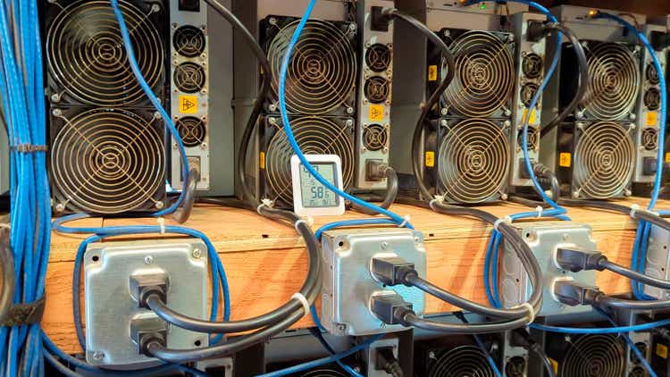 Close-up of ASIC machines, in series, mining cryptocurrencies.  A cryptocurrency mining farm.