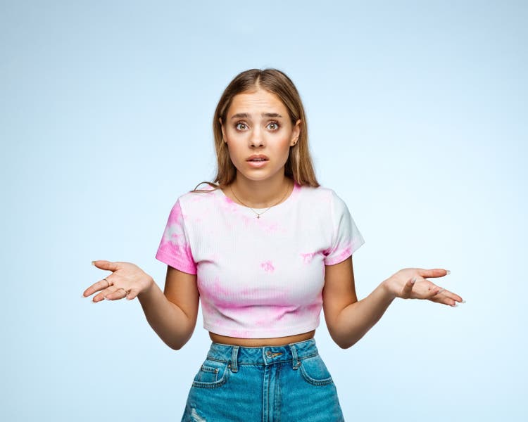 Blond girl with surprised facial expression