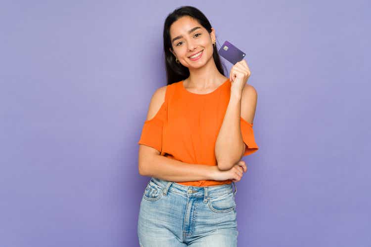 Smiling woman buying things with a credit card