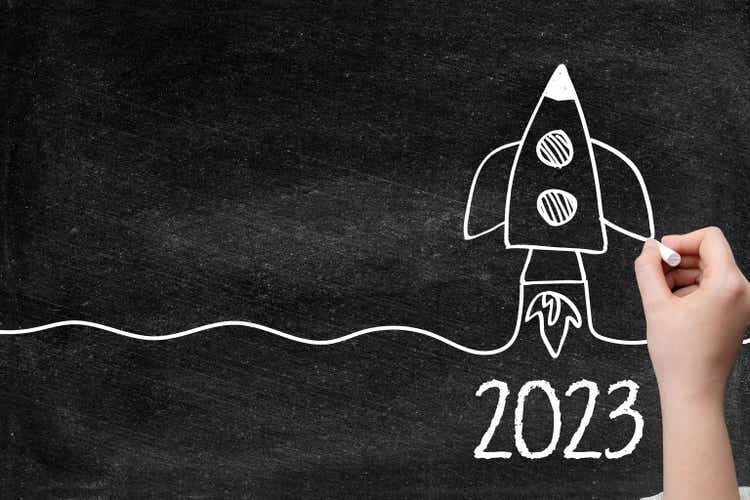 2023 Creative idea concept with rocket on blackboard