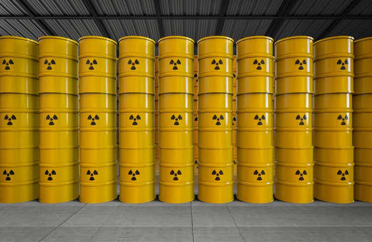 Group of yellow barrels with radiation hazard sign