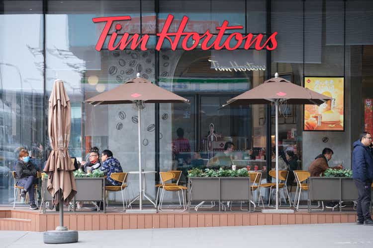 Chinese customers sitting at Tim Hortons coffee store
