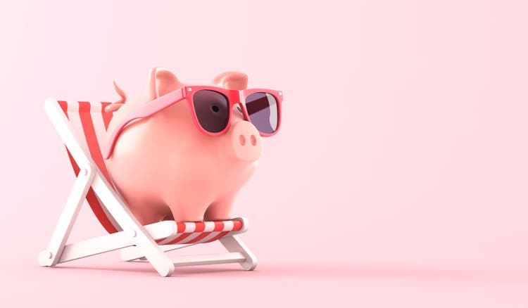 Pink piggy bank sat in a deckchair