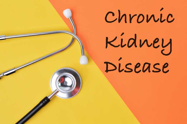 Stethoscope over yellow and orange background written with CHRONIC KIDNEY DISEASE