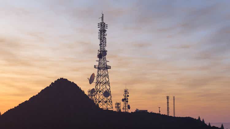 Telecommunication Tower With Antennas At Sunset