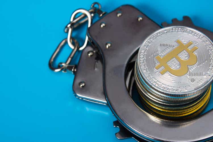 Bitcoins and handcuffs