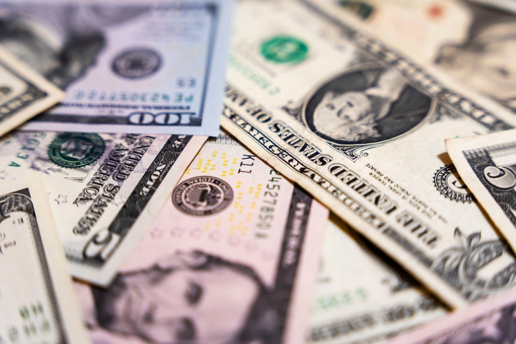 there are dollar bills on the table . background of banknotes