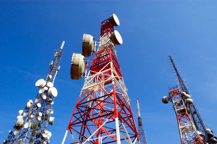 Telecommunications tower, blue sky with clouds