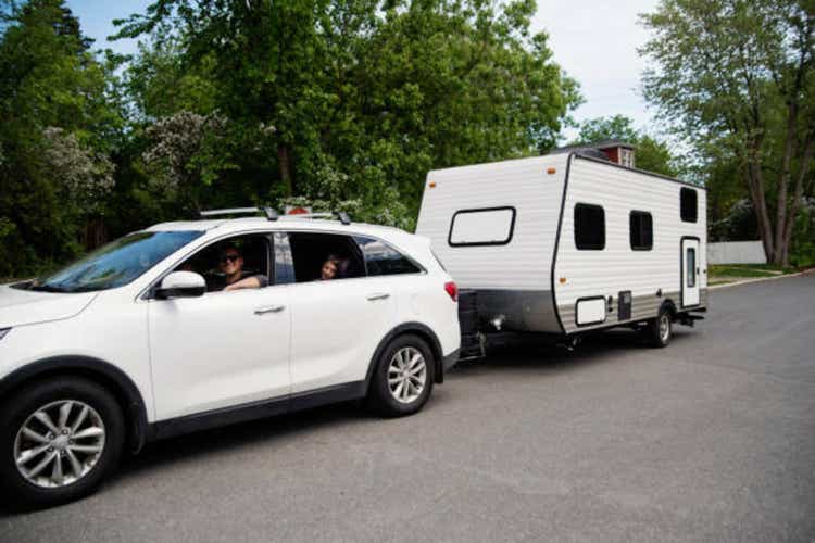 Family getting ready to leave with RV for summer vacations.