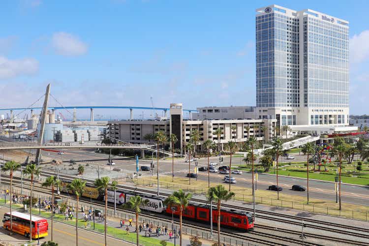 San Diego Trolley Train with Hilton San Diego Bayfront Hotel Background