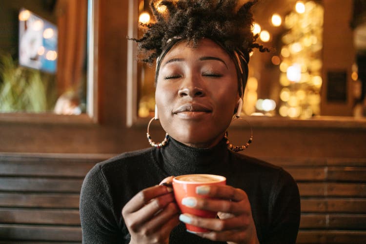 African woman having a coffee