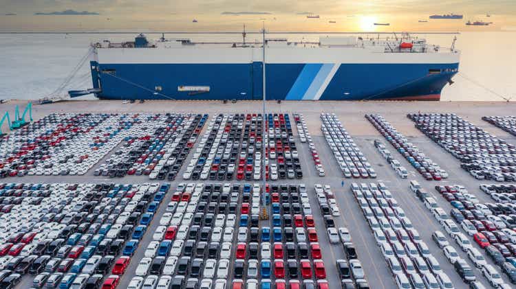 Aerial view vehicle carrier vessel loading car for shipping to worldwide, Large RoRo (Roll on/off) vehicle car carrier, New car lined up in the port for import export around the world.