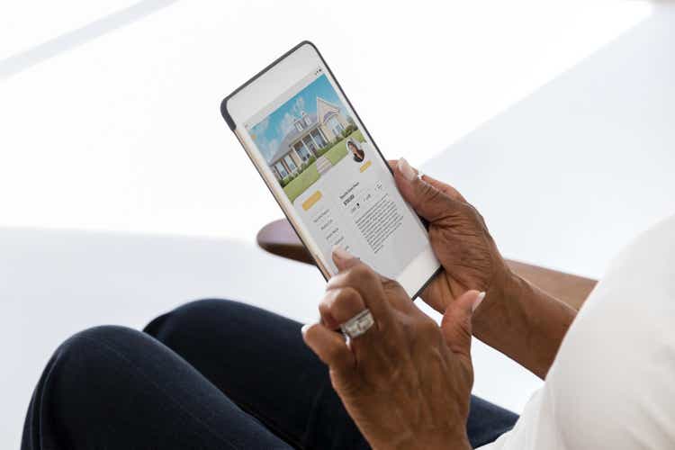 Woman uses mobile app to shop for home
