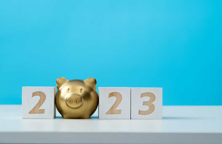 2023 new year and piggy bank on the table
