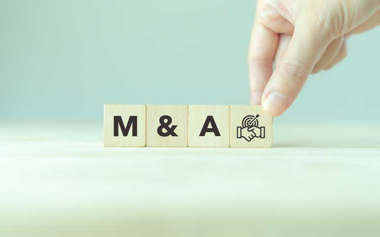 Business mergers and acquisitions concept. Share acquisition, asset business acquisition, amalgamation. Business review and development model. The abbreviation M and A on smart background, copy space.