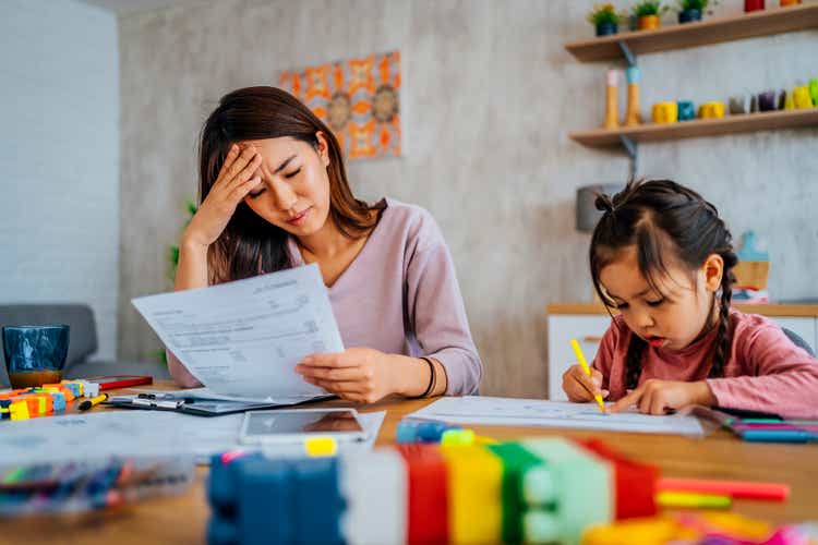 Worried mother going through her financials