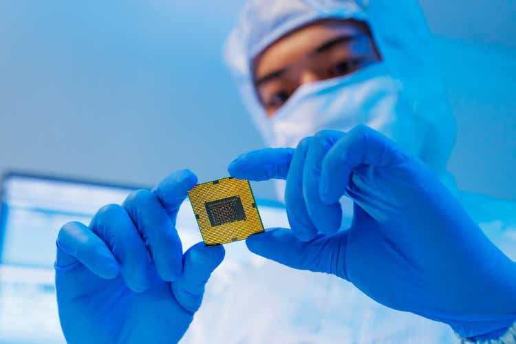 engineer holds microchip