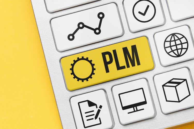 Concept PLM or Product lifecycle management. Business acronym. Holographic icons and text on the keyboard