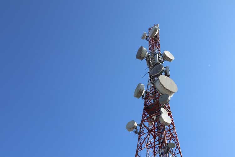 " communication tower. Telco Trellis for 3G 4G 5G Apocalypse Internet Communication, mobile, FM Radio and Television Broadcasting On Air with Blue Sky in Background"