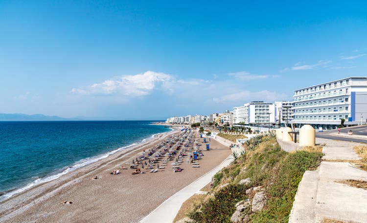 Long and famous Akti Miaouli sandy beach on the western side of the island of Rhodes, Greece