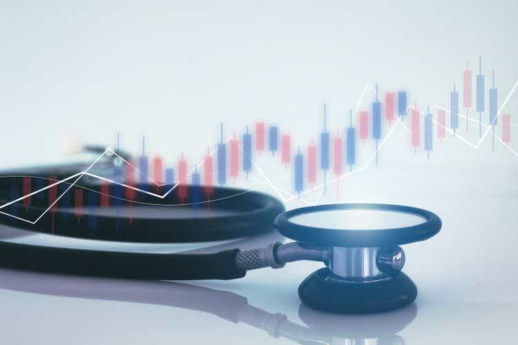 Stethoscope and financial graph, healthcare business.