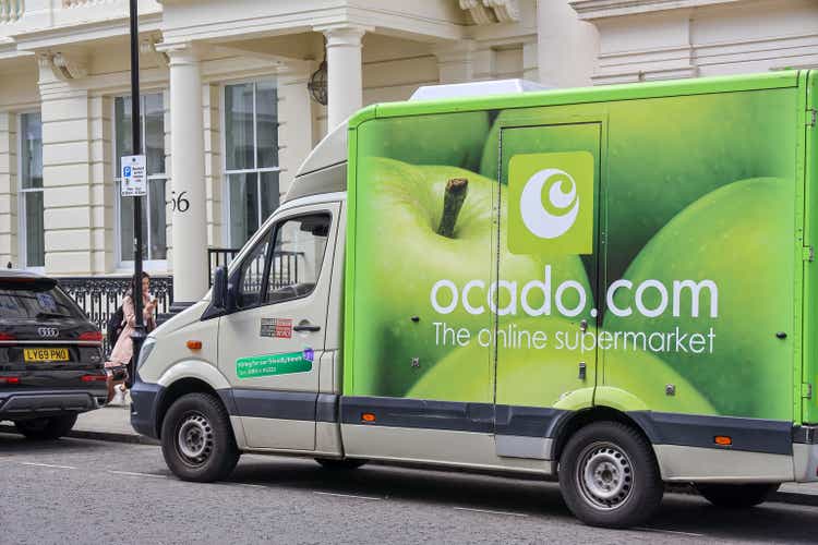 A Ocado grocery home delivery lorry parked at the side of the street.