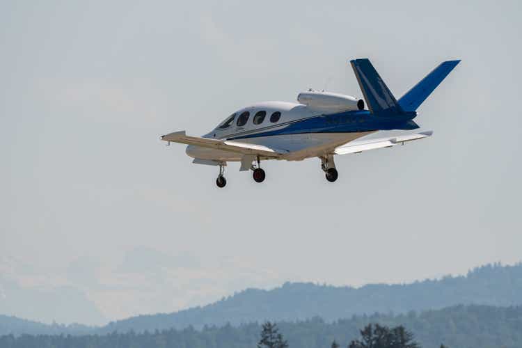 Cirrus Vision SF50 plane is arriving on runway 14 in Zurich in Switzerland