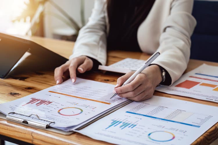 Successful female entrepreneurs are analyzing market data, budgets, taxes, investments, risk management in the workplace