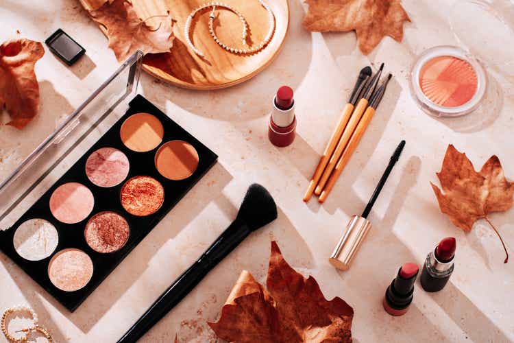 Autumn skincare and autumn makeup concept with beauty products on table