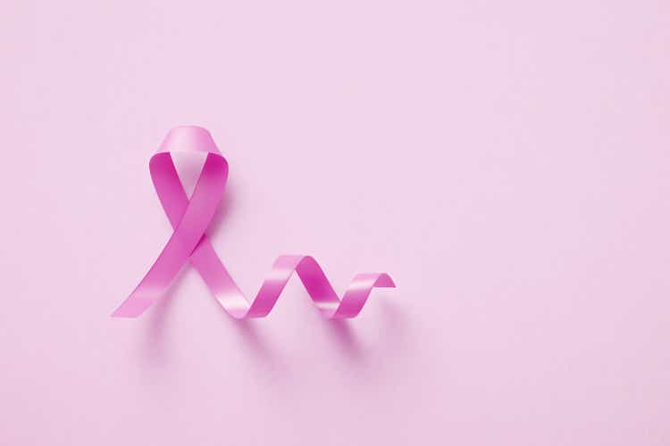 Pink Breast Cancer Awareness Ribbon On Pink Background