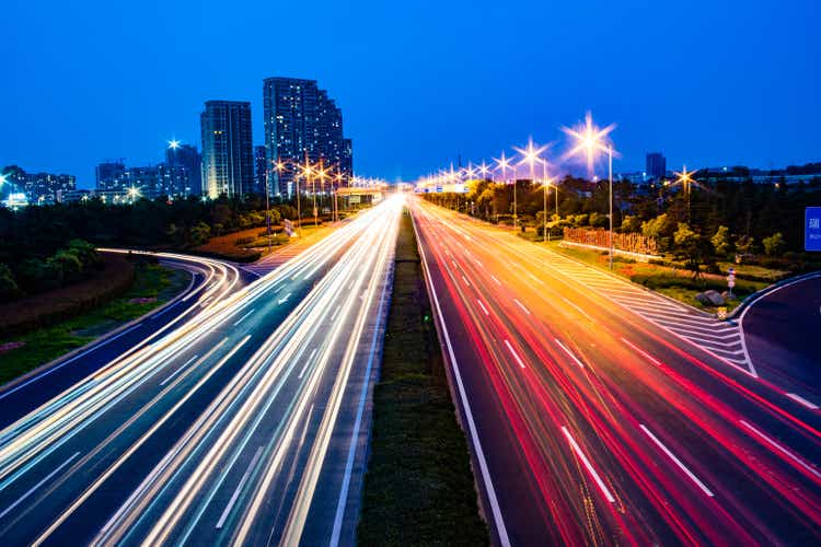 High-speed cars leave beautiful light tracks.