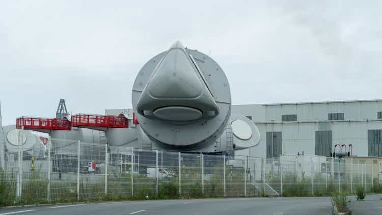 Saint Nazaire, France. View of the generator assembled on the upper part of the wind turbine. Big metal part ready to use to building a wind turbine. Green energy. GE factory