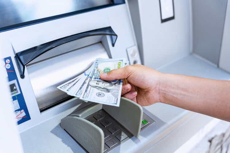 Atm machine money cash. Holding american bill cash. Woman withdraw money usd hundred dollar. Us dollar bill, bank credit card.