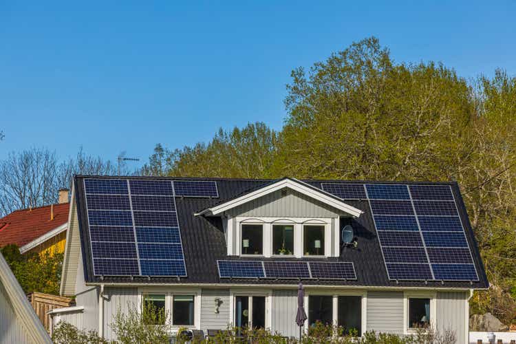 Beautiful view of house roof equipped with solar panels. .