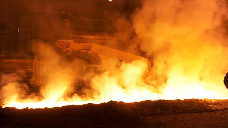 Transportation of molten hot steel in the chute, heavy industry concept. Stock footage. Hot molten steel in iron and steel enterprise.