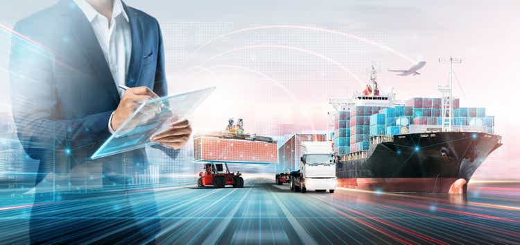 Smart logistics global business and warehouse technology management system concept, businessman using tablet to control delivery network distribution import export, double exposure future transportation