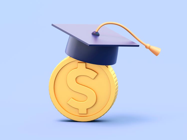 Graduation hat on a gold dollar