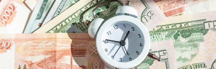 politic, money, economy and investment plan. new year economy crisis and change. money, alarm clock ,finance background. web banner