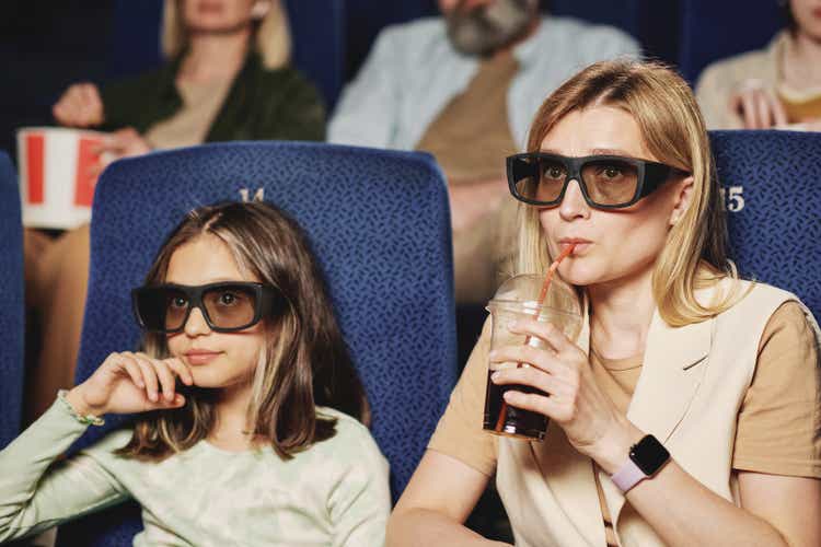 Mother And Daughter At Cinema