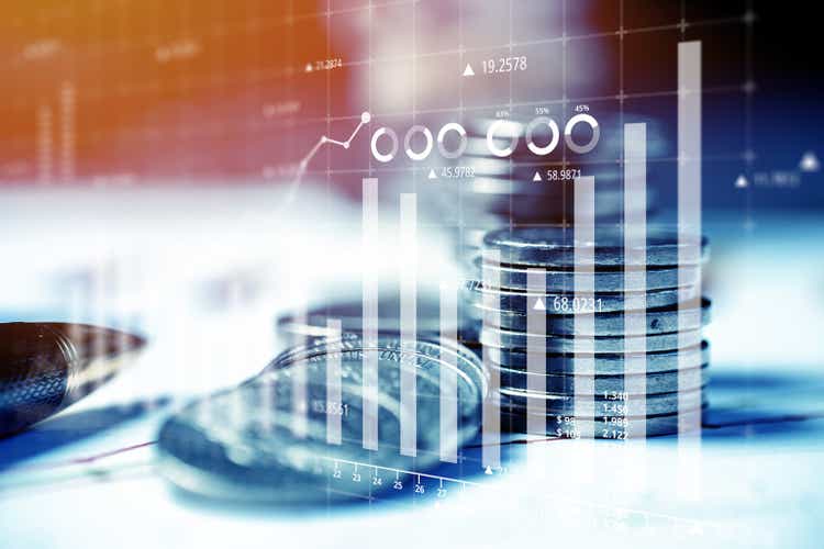 Money and business concept. Reporting charts on investment and success against the background of coins