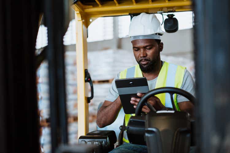 Worker on forklift