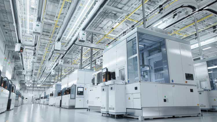 Inside Bright Advanced Semiconductor Production Fab Cleanroom with Working Overhead Wafer Transfer System