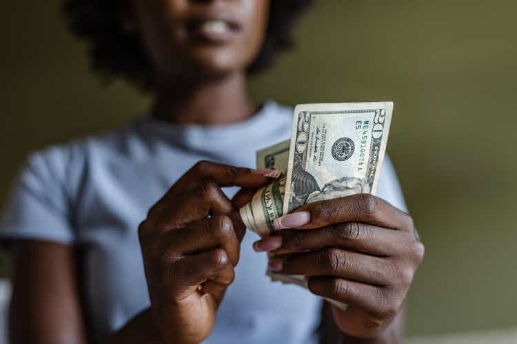 Close up of a female counting money