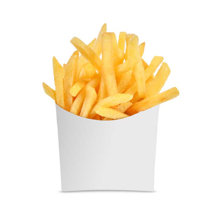 French fries in a white paper box isolated on white