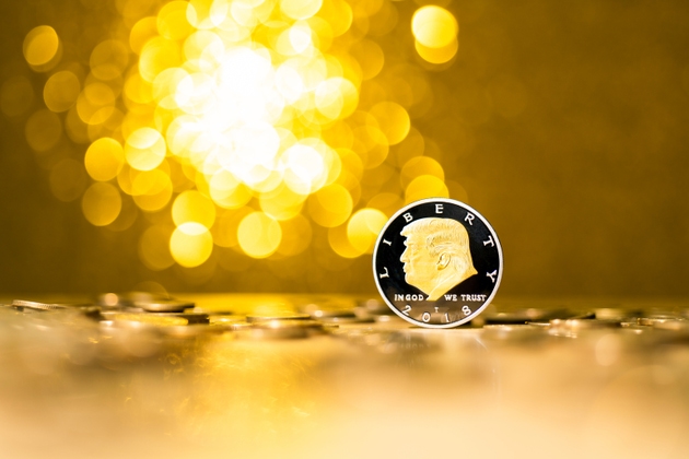 Coin with Donald Trump on shiny background