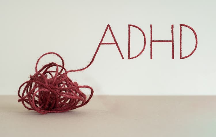 Knot written "ADHD" by using red rope.
