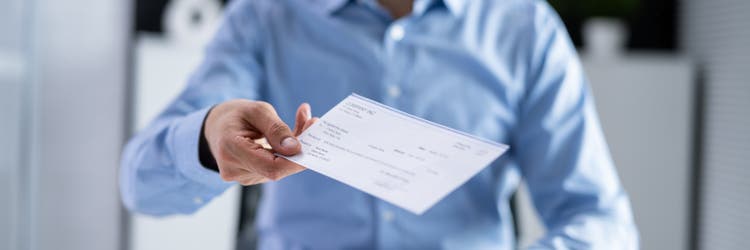 Executive Hand Giving Payment Check