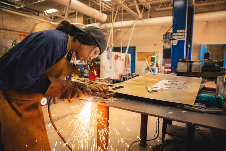 Young Teenage Woman Welding